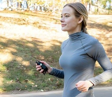 Woman running to safety while holding Hootie