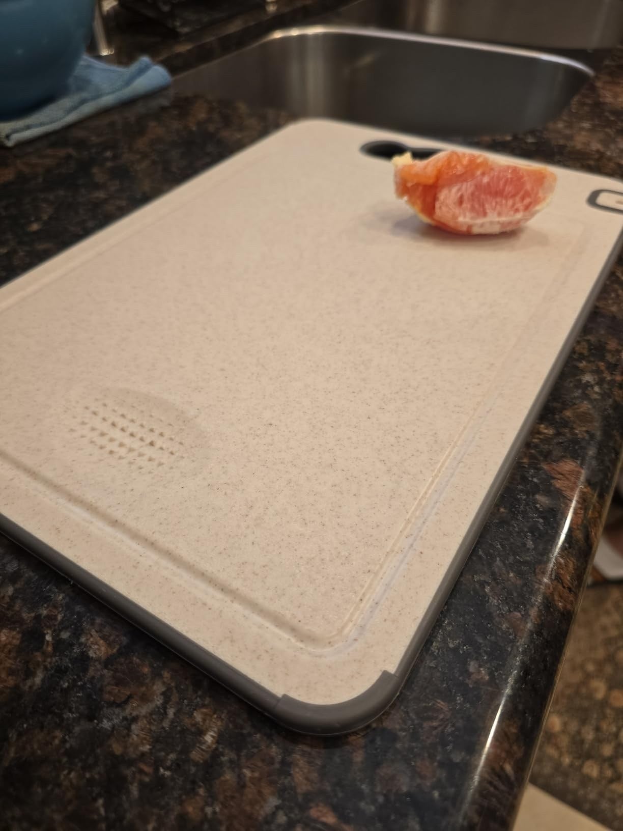 TIBO cutting board photographed by customer Arsen Karadanyan, with a grapefruit segment on the wheat straw side