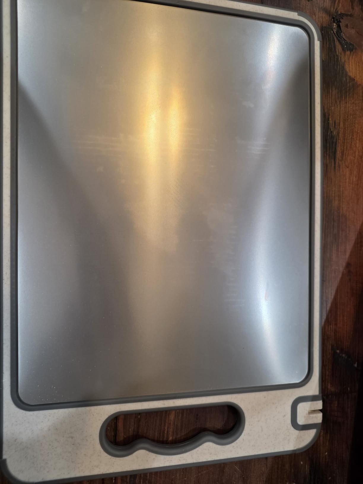 TIBO cutting board photographed by customer Edward I Hed, showing the brushed titanium side